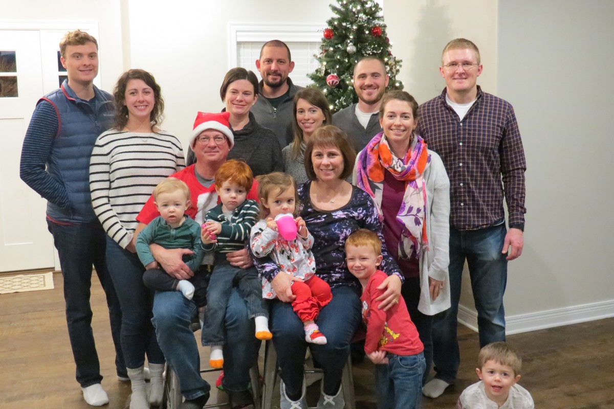 Mark Logel (wearing a Santa hat) celebrates the holidays with his growing family