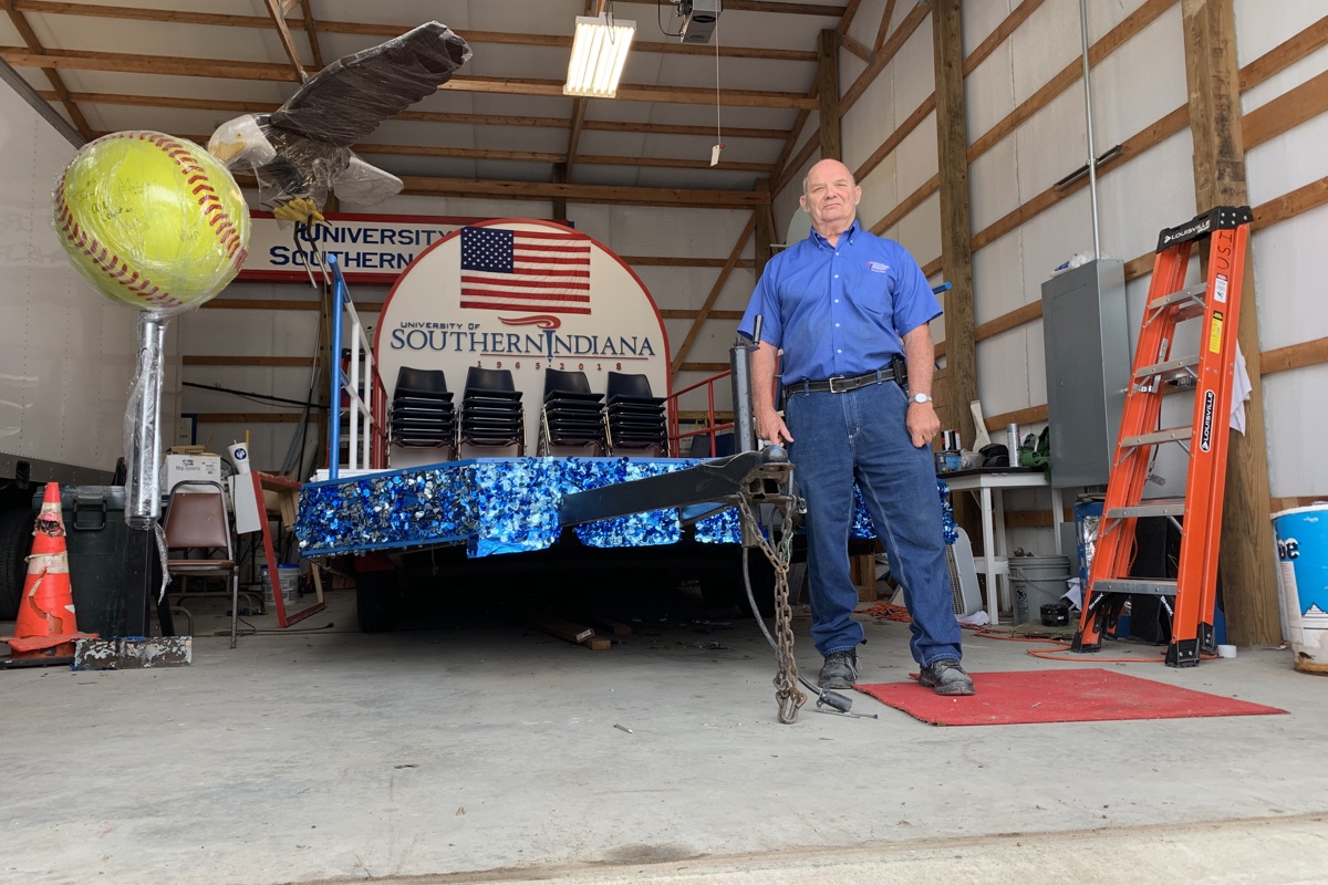 Jerry Bulger poses in the campus garage where he works on USI's annual West Side Nut Club Fall Festival Parade float