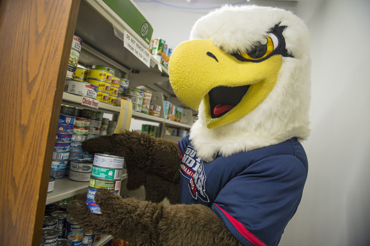 Archie helps out in Archie's Closet, USI's free food and personal hygiene supplies resource