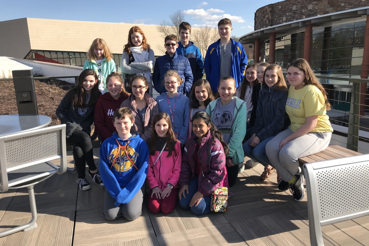 Members of Castle North Middle School's generationOn Club pose atop USI's Fuquay Welcome Center
