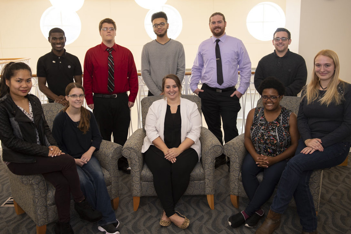 Aaron Pryor (standing, seconding from right), Program Director for USI Student Support Services, and other authors from TRIO Tenacity: Stories of Student Success.
