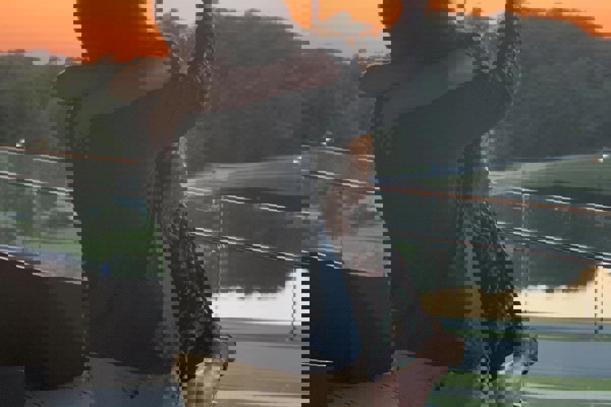 USI students Reid Edwards and Emily Miller embrace on the balcony of the Business and Engineering Center after their engagement September 21, 2020.