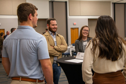 Braden with Emily and USI students