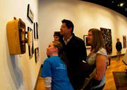 Honors students examining a sculpture from 2009 Senior Seminar Exhibition