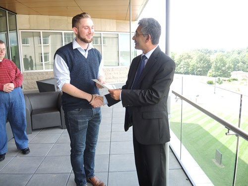 Dean shaking Donald's hand