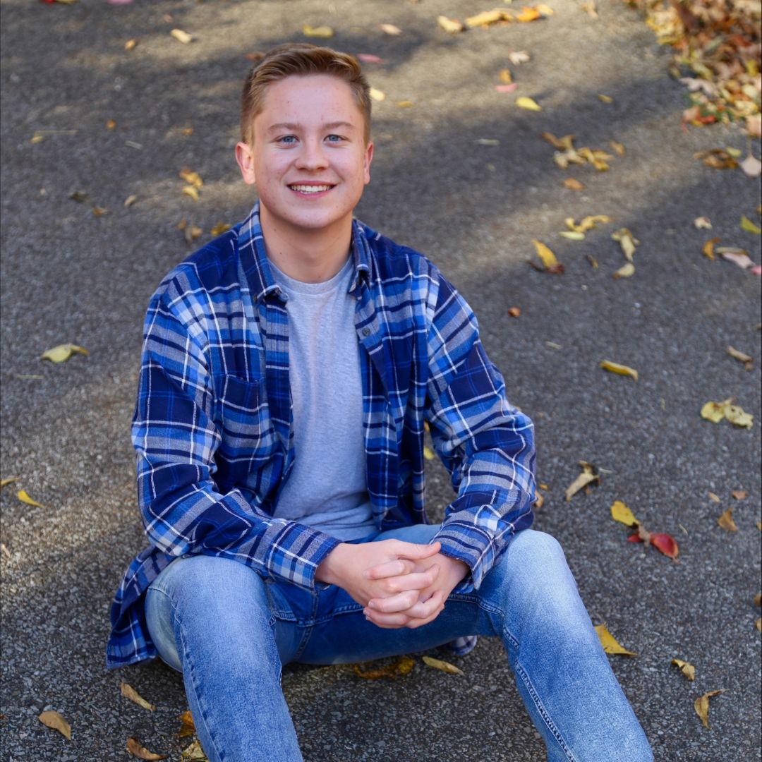 Lucas with fall leaves